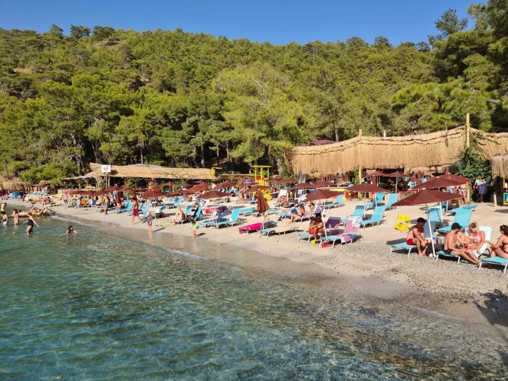 Help Beach on the Fethiye Peninsula with clear water, sunbeds and beach club setting