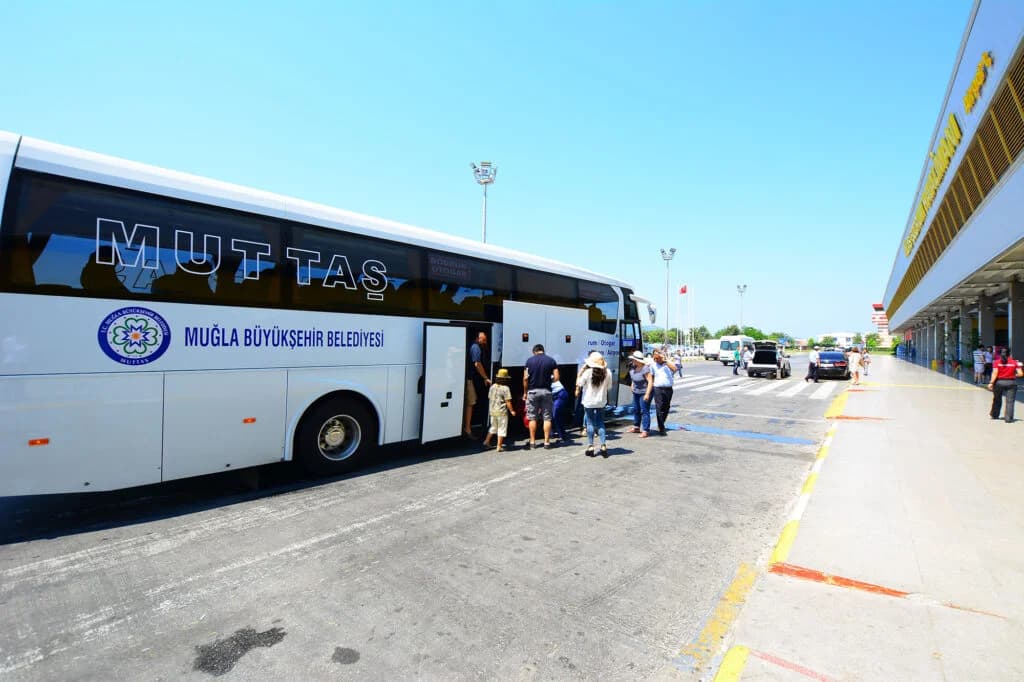Shuttle buses waiting outside Dalaman Airport terminal