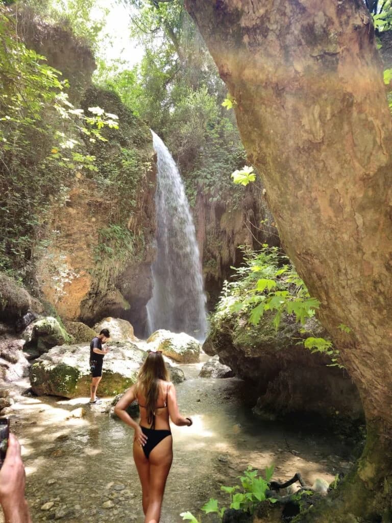 Visitors walking the stream path towards Gizlikent Waterfall